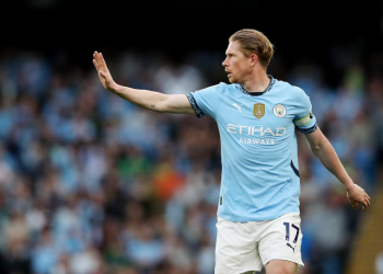 Kevin De Bruyne with manchester city fans in the background