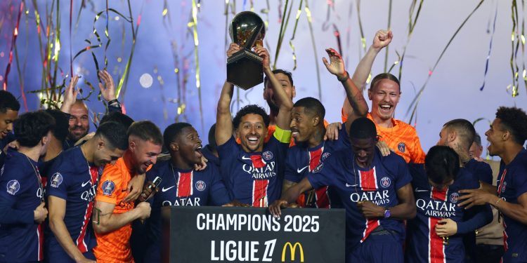 Paris St Germain's Marquinhos lifts the Ligue 1 trophy (Reuters)