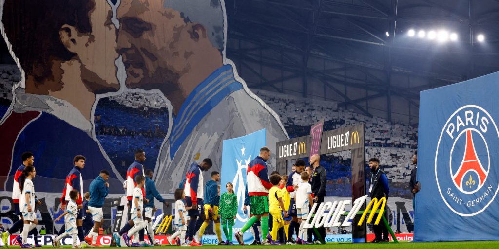 Olympique de Marseille and Paris St Germain players walk out before the match (Reuters)