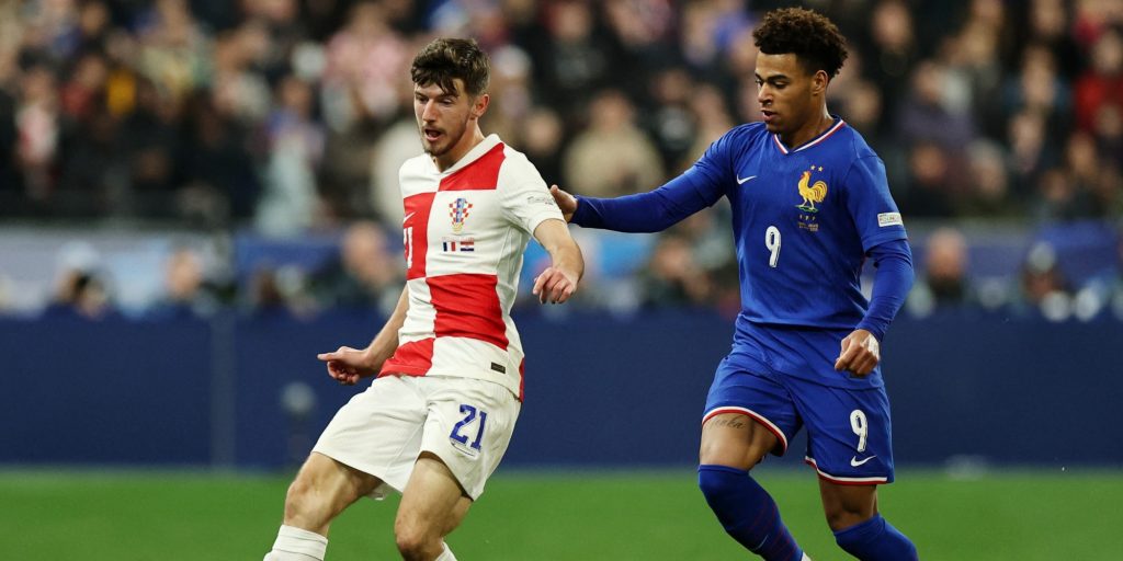 France's Desire Doue in action with Croatia's Petar Sucic in March 2025 (Reuters)