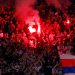 Olympique Lyonnais fans with flares in the stands (Reuters)