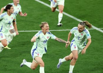 Wales' Jessica Fishlock celebrates scoring their first goal with Lily Woodham (Reuters)