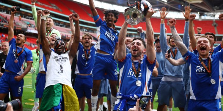 Oldham celebrate winning National League play-offs (Reuters)