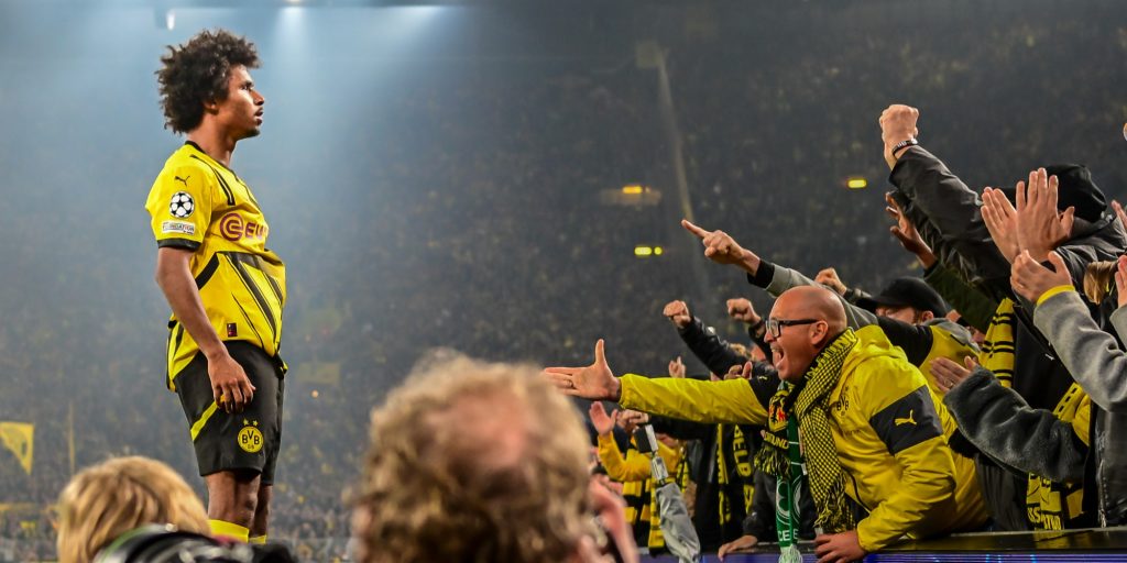 Borussia Dortmund's Karim Adeyemi celebrating with fans (Imagn)