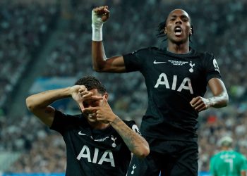 Spurs players celebrate scoring a goal (Reuters)