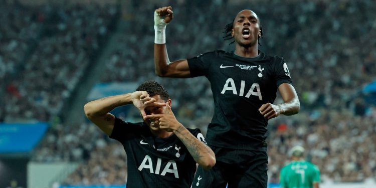 Spurs players celebrate scoring a goal (Reuters)