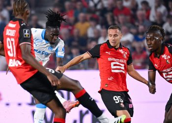 Marseille's Jonathan Rowe in action against Stade Rennais (Imagn)