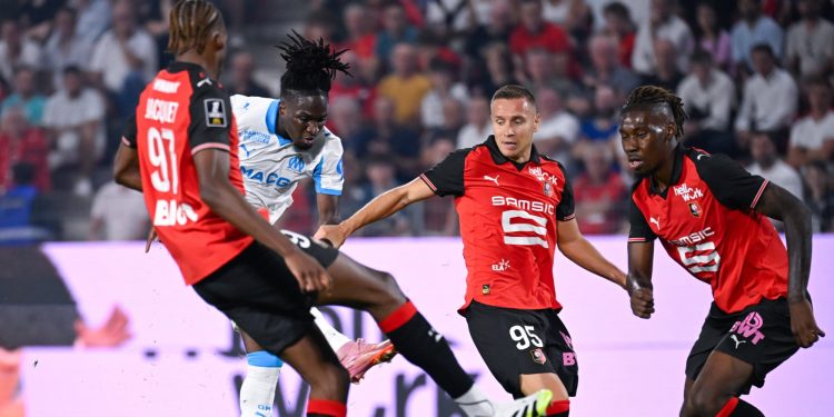 Marseille's Jonathan Rowe in action against Stade Rennais (Imagn)