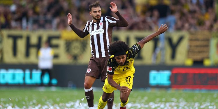 Dortmund's Karim Adeyemi and St. Pauli's Danel Sinani during their Matchday 1 fixture. (Reuters)