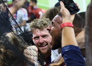 Pavel Sulc and Corentin Tolisso celebrate Lyon's goal against Marseille (Reuters)