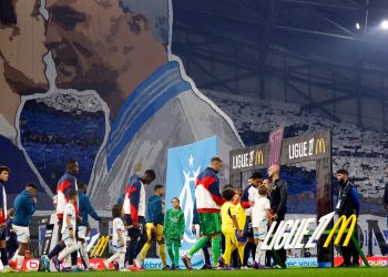 Olympique de Marseille and Paris St Germain players walk out at Orange Velodrome (Reuters)