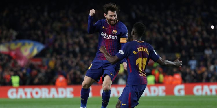 Dembele and Messi celebrate a goal together during their time at Barcelona (Reuters)