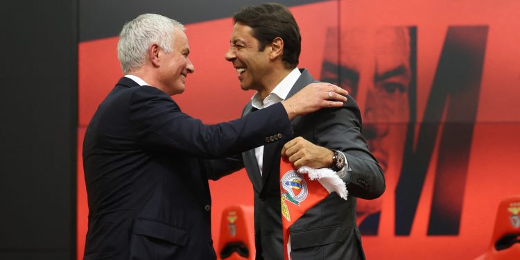 Benfica coach Jose Mourinho and president Rui Costa embrace during the press conference (Reuters)