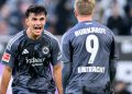 Can Uzun celebrating a goal with Frankfurt striker Jonathan Burkardt (Imagn)