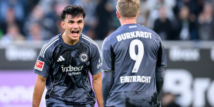Can Uzun celebrating a goal with Frankfurt striker Jonathan Burkardt (Imagn)
