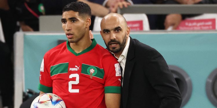 Morocco's Achraf Hakimi and Walid Regragui (Reuters)